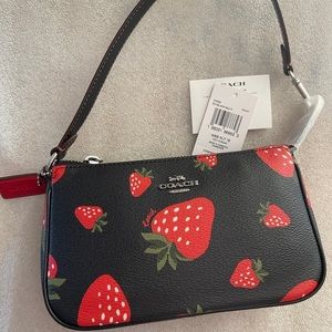 Brand new with tags, designer coach bag, black with strawberry print.